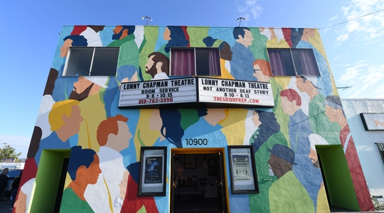 Brightly colored mural on facade of Lonny Chapman Theatre