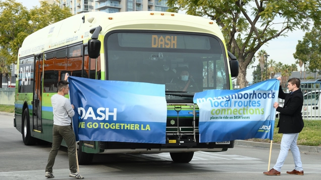 NoHo DASH Bus breaking the ribbon